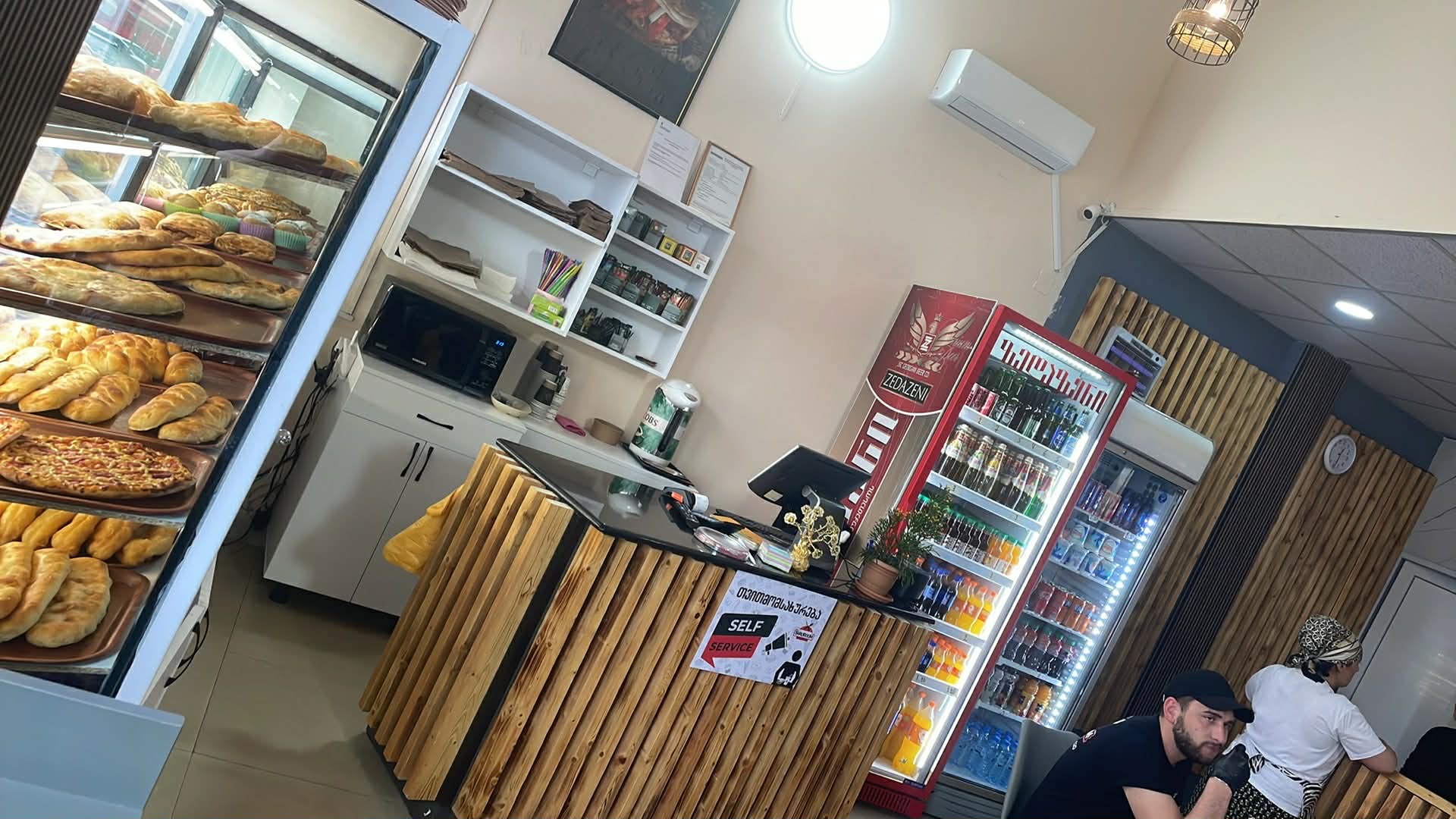 SHAUROOM counter, drinks fridge and bakery display